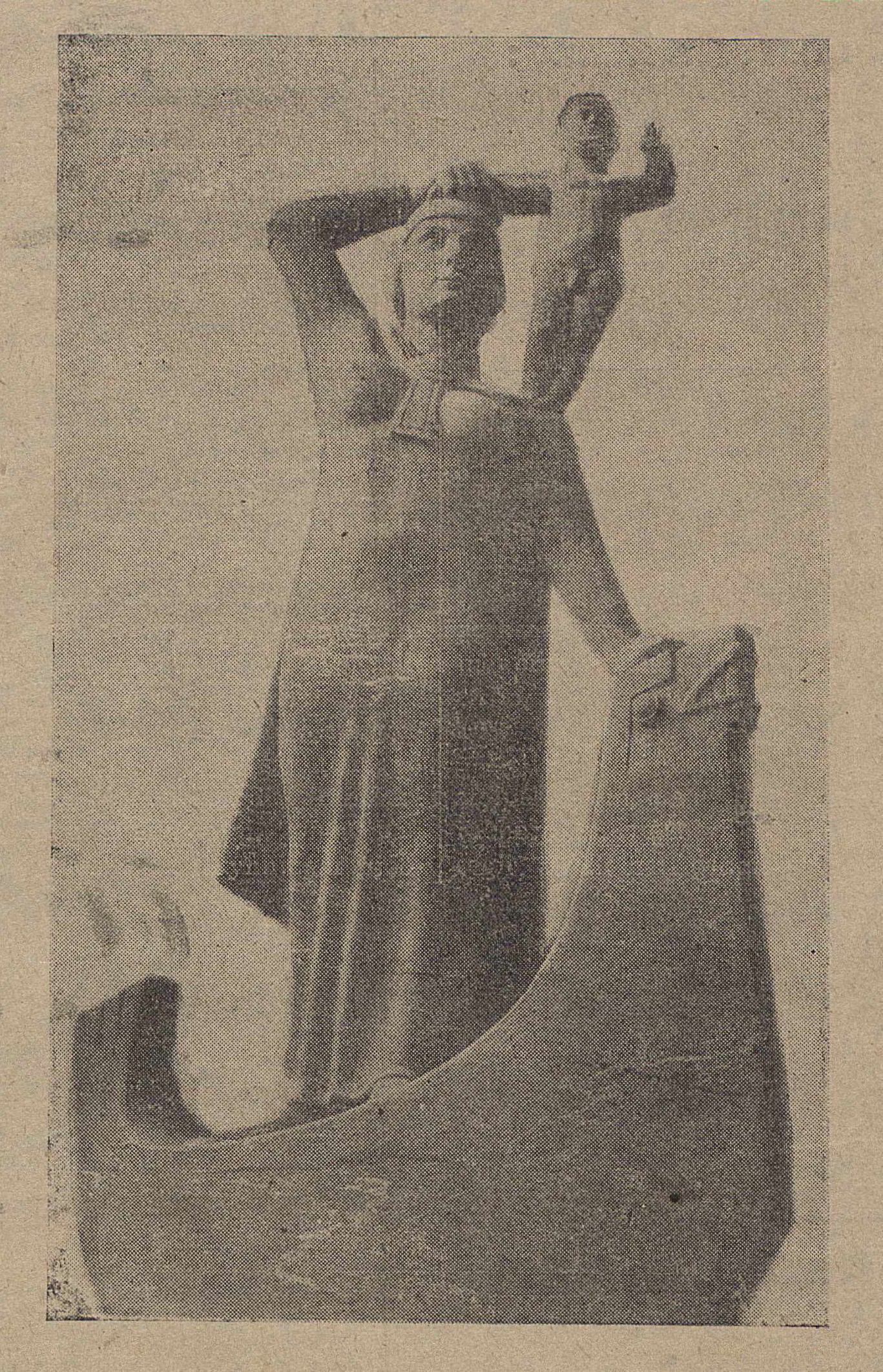 image of Ásmundur Sveinsson’s Fyrsta hvíta móðirin í Ameríku from the December 1, 1938 issue of the Icelandic newspaper Alþýðublaðið. This is a sepia-toned and faded photograph from a newspaper depicting a female with a baby on her right shoulder. The woman is standing in a small canoe-looking boat.
